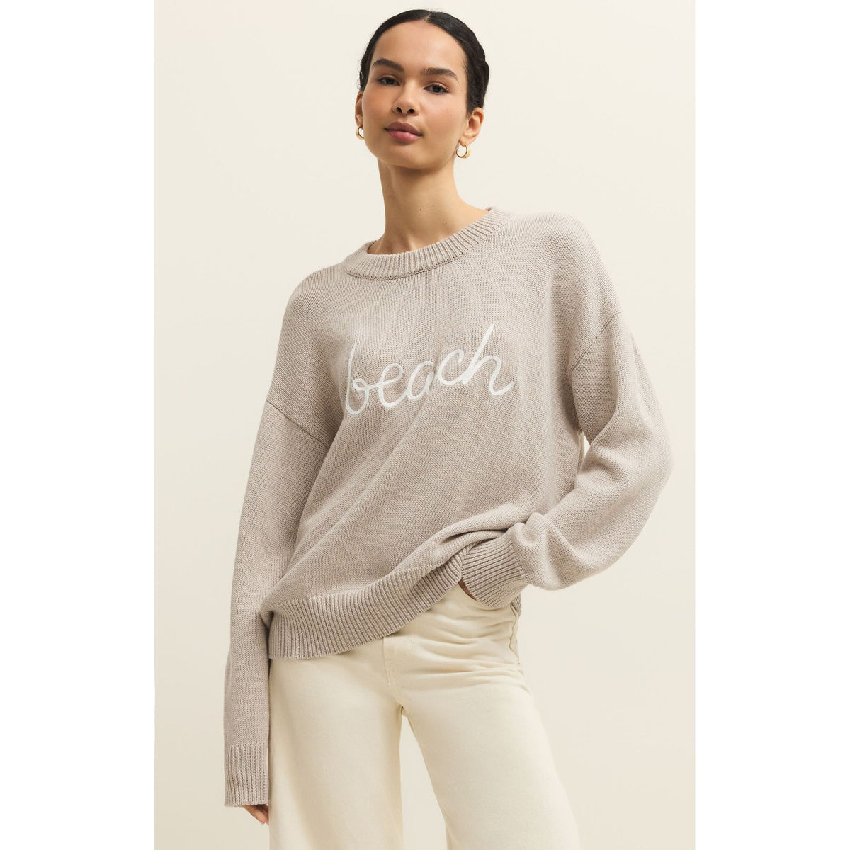Z Supply Boyfriend Beach Sweater in beige mid-weight knit with beach script, 100% cotton, crew neck, long sleeves.