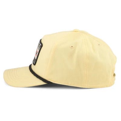 Cream trucker hat featuring black mesh back, black brow band, and Tom Petty graphic patch on the front panel.