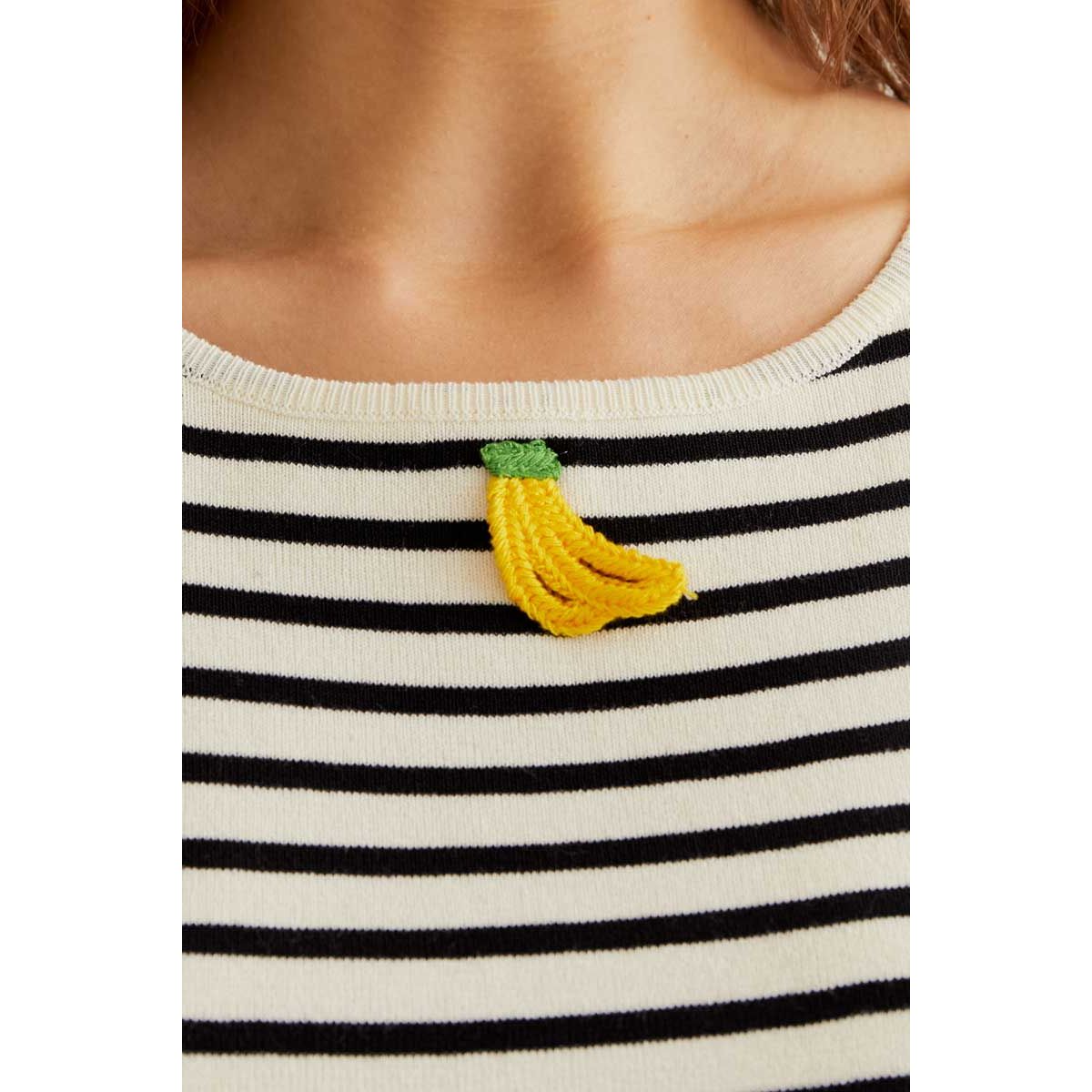 Banana graphic on striped cream and black knit tank top