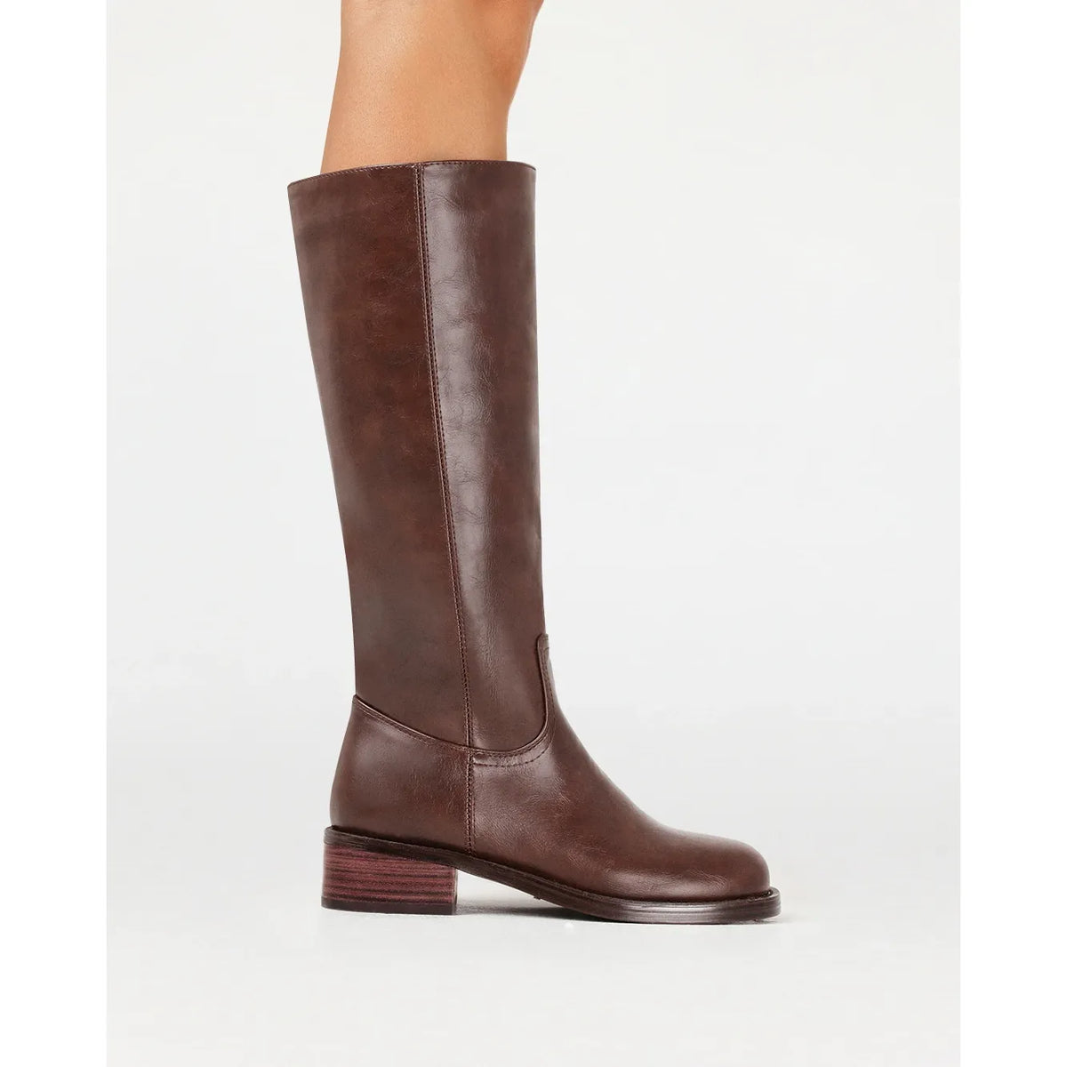 Billini Jamison brown knee-high boot with structured shaft and striped block heel for cool weather elegance.