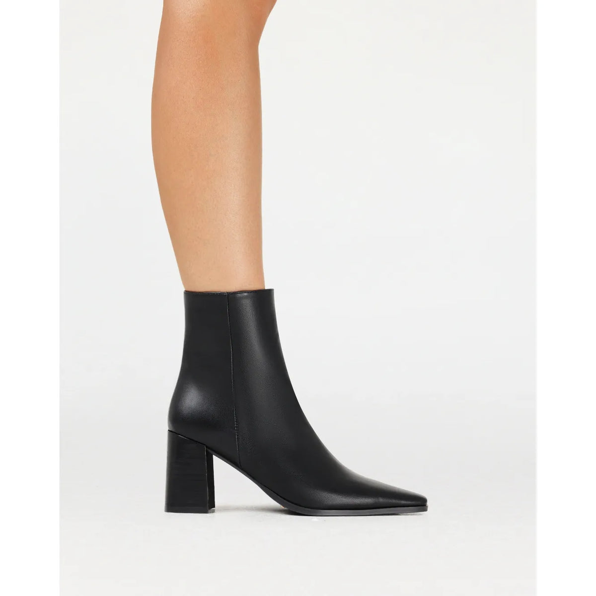 Black Billini Ozi boot featuring a sleek square toe and mid-flare block heel for effortless sophistication.