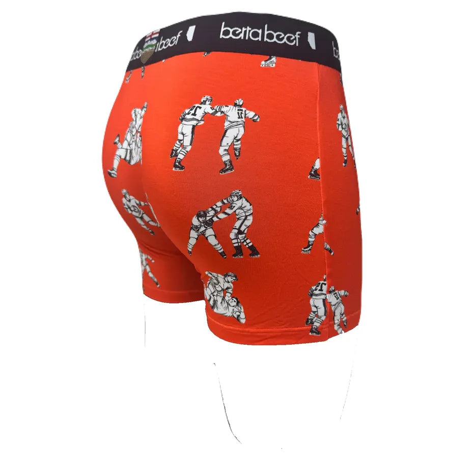 Berta Beef Fighting Major Boxer Briefs in orange with white boxing figure prints and black waistband.