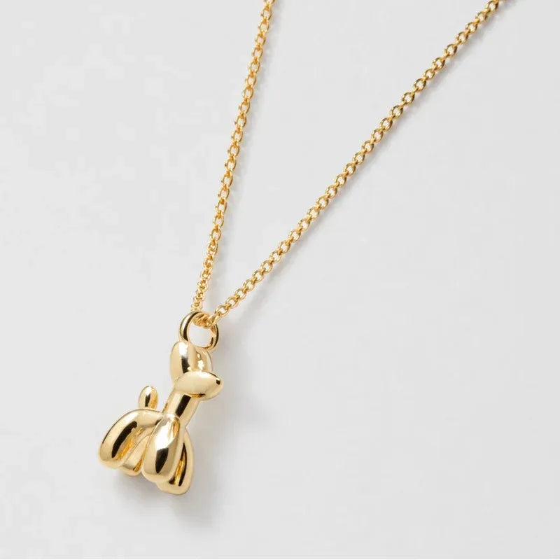 Gold necklace featuring a sculpted balloon dog pendant. A playful and trendy charm that adds a nostalgic twist to everyday style.