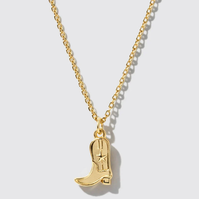 Gold chain necklace featuring a detailed cowgirl boot pendant with an embossed star design for playful, western-inspired style.