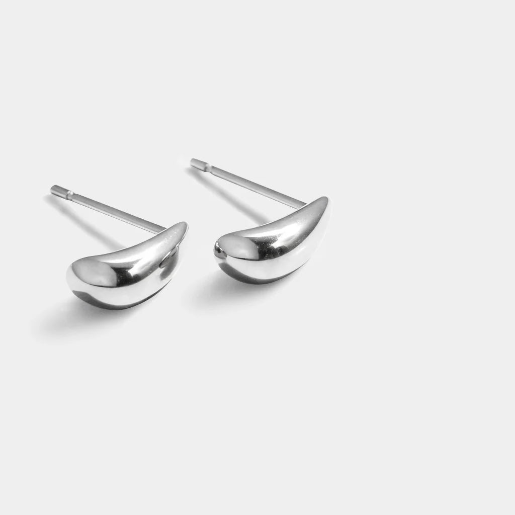 Minimalist silver drop earrings in teardrop shape (0.5 × 1 cm); stainless steel with post backs.