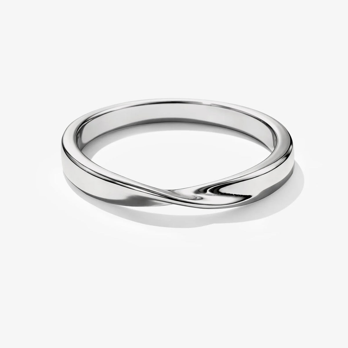 Twisted Metal Ring in silver-tone stainless steel with a sleek curved twist, hypoallergenic and elegant.