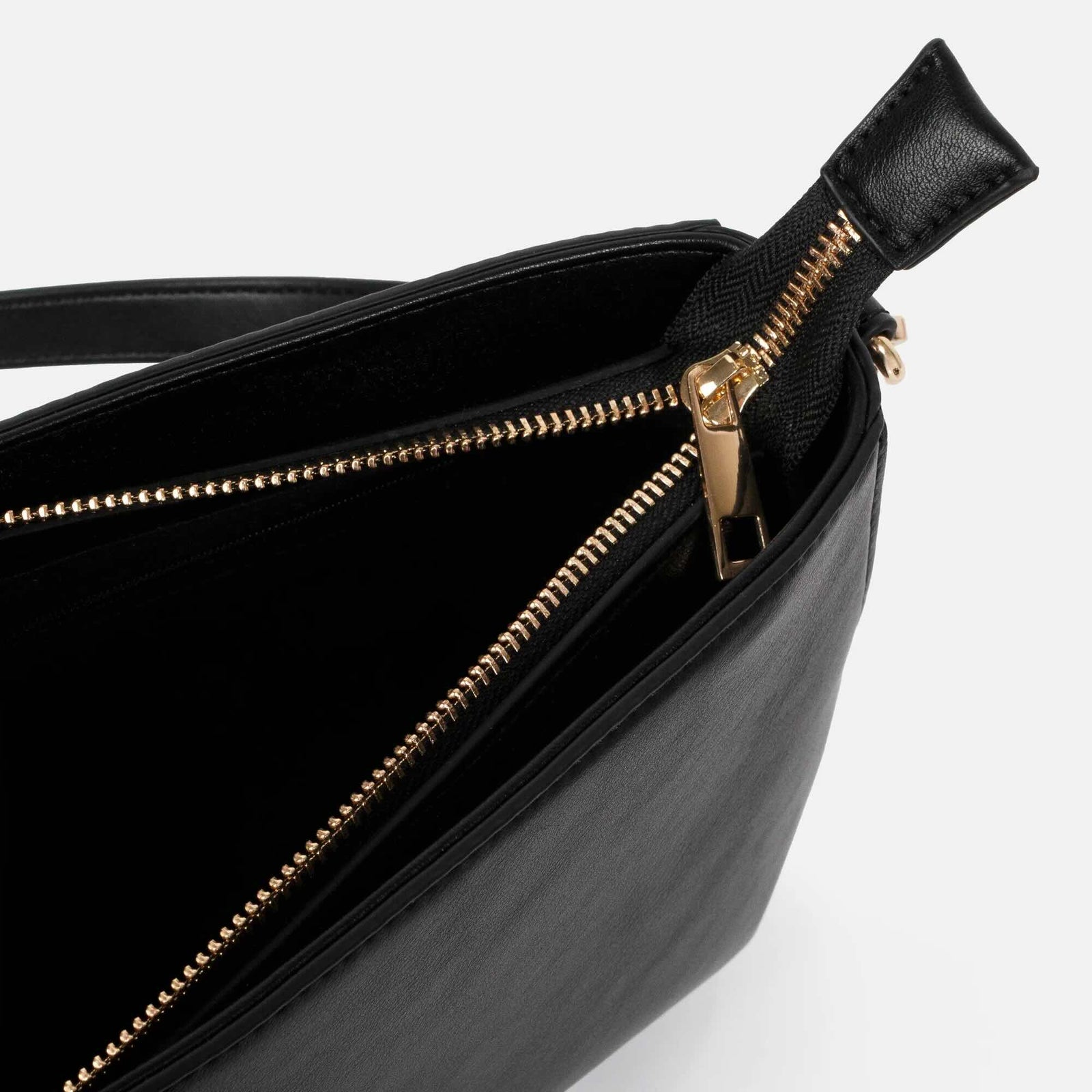 Black smooth PU handbag with gold-tone zipper and hardware, minimalist and versatile.