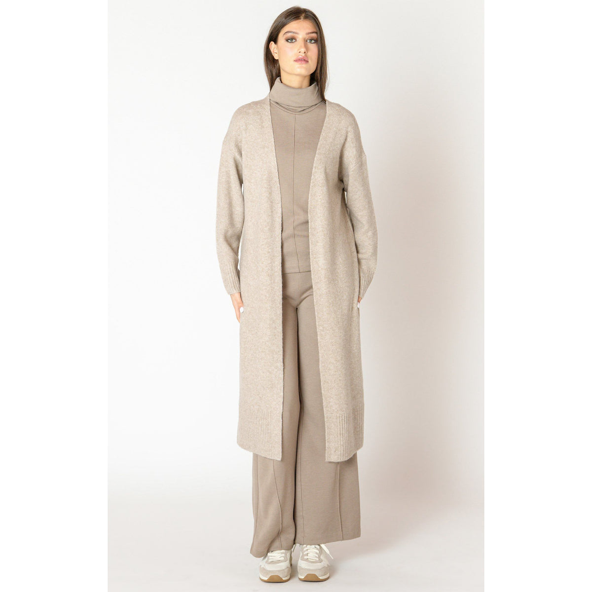 Dex Black Tape Longline Open Cardigan on model, taupe knit turtleneck with matching wide-leg pants.