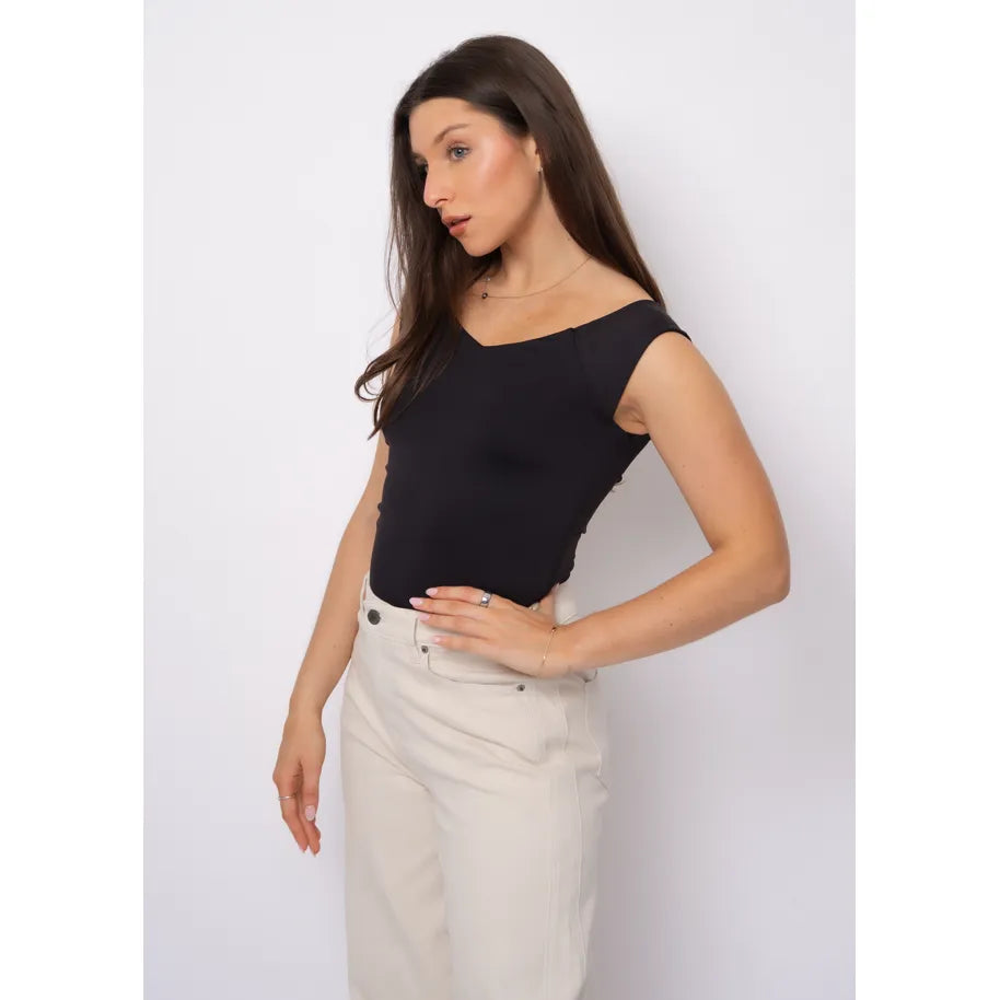Bovia 23 Off Shoulder Top in black on model, sleeveless with off-shoulder neckline.