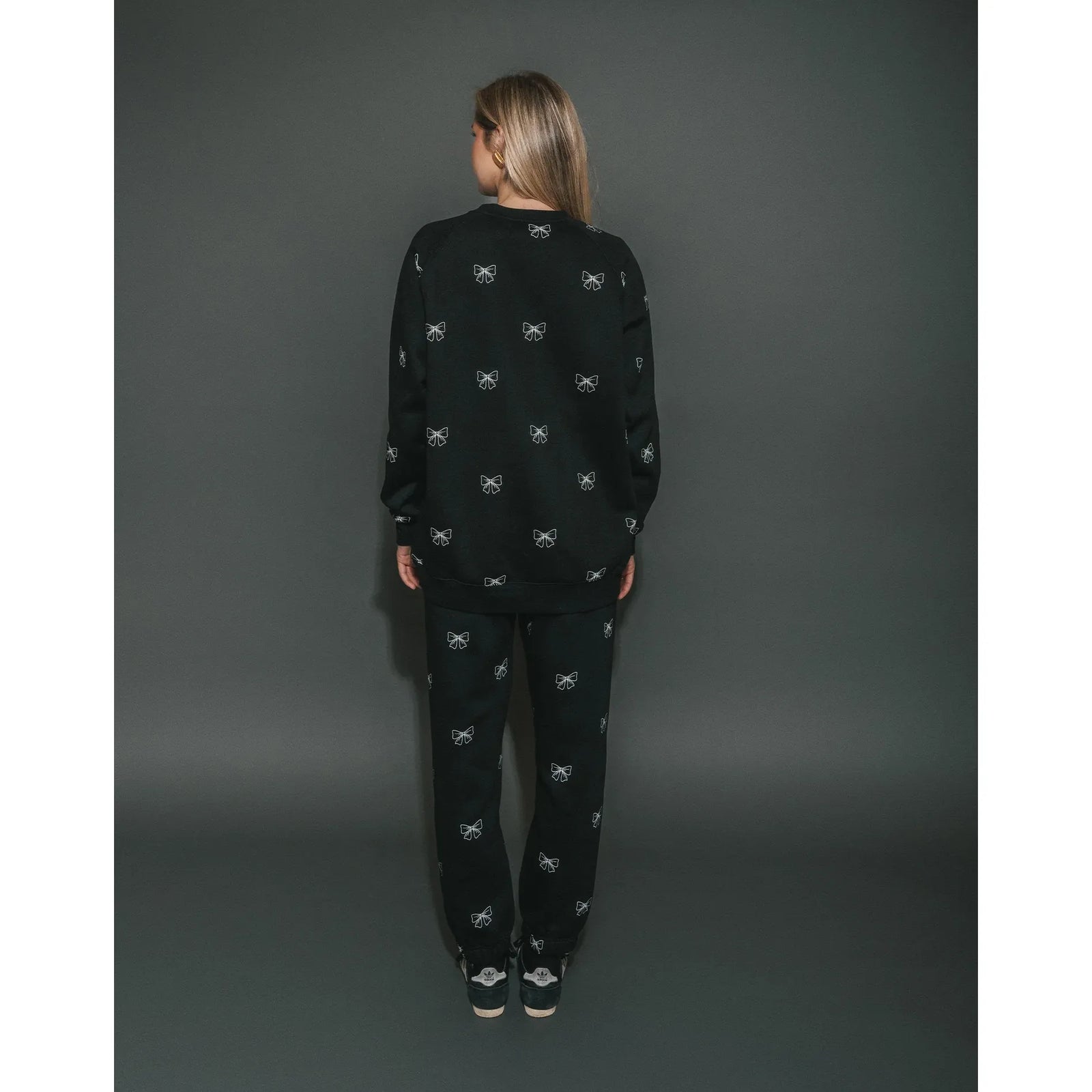 Brunette the Label black all-over bow print oversized crew with matching joggers, back view on model.