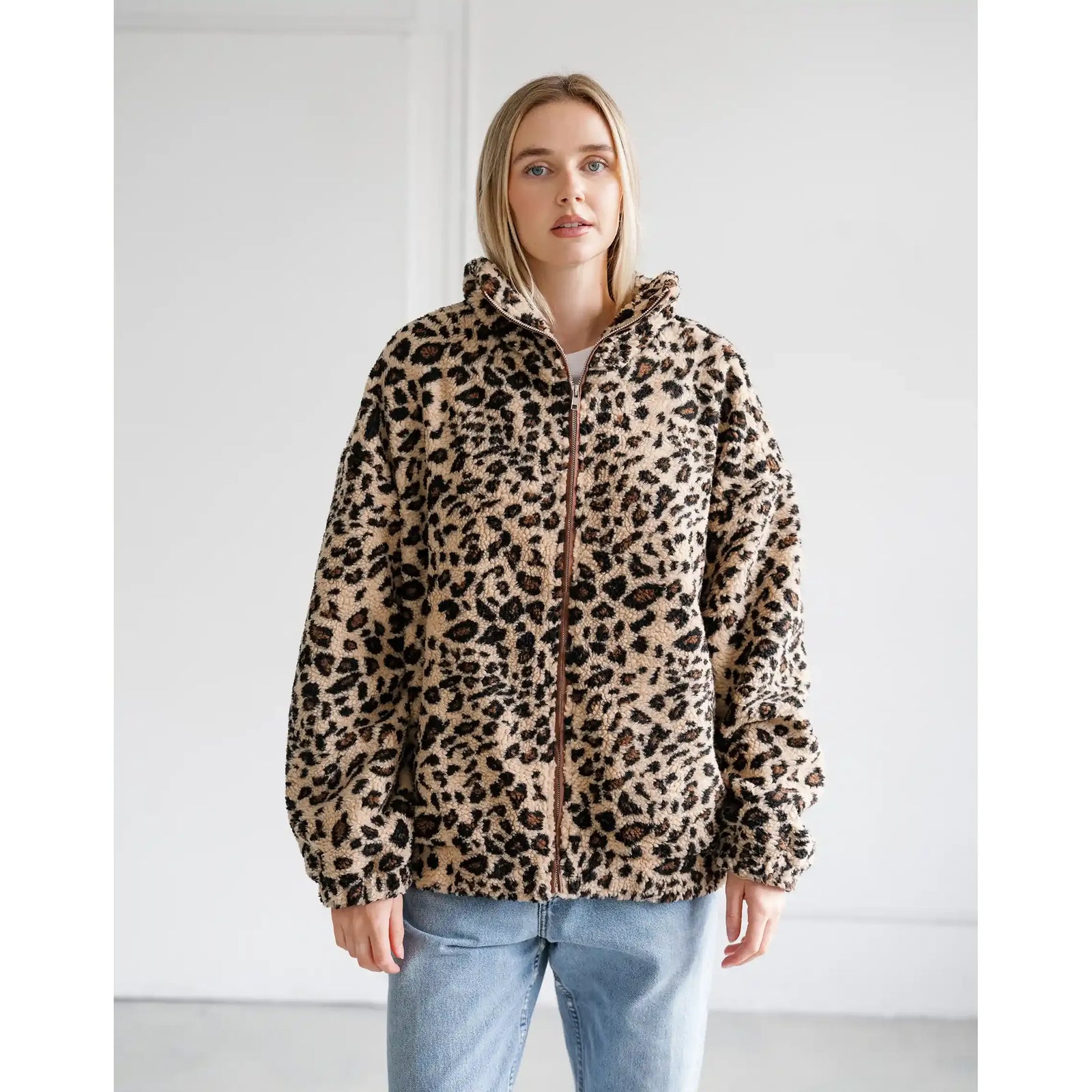 Oversized leopard print sherpa jacket with full zip front and relaxed fit.