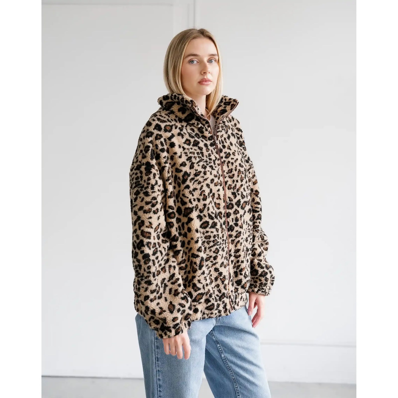 Oversized leopard print sherpa jacket with full zip front and relaxed fit.