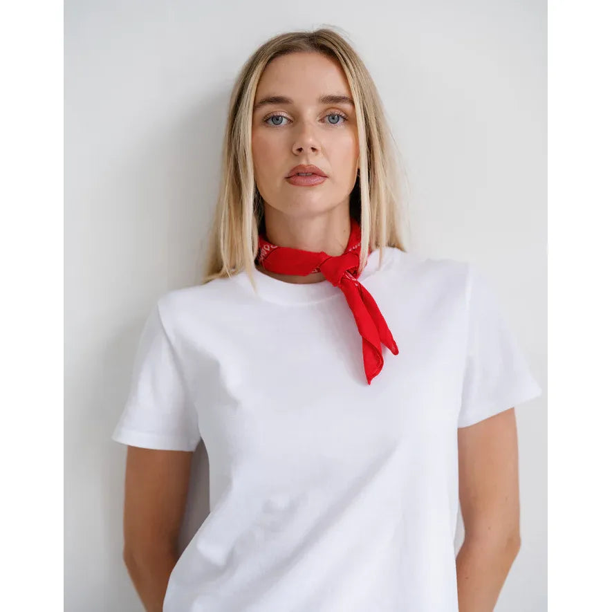 Brunette the Label Western Bandana tied as a red neck scarf on a model in a white T-shirt.