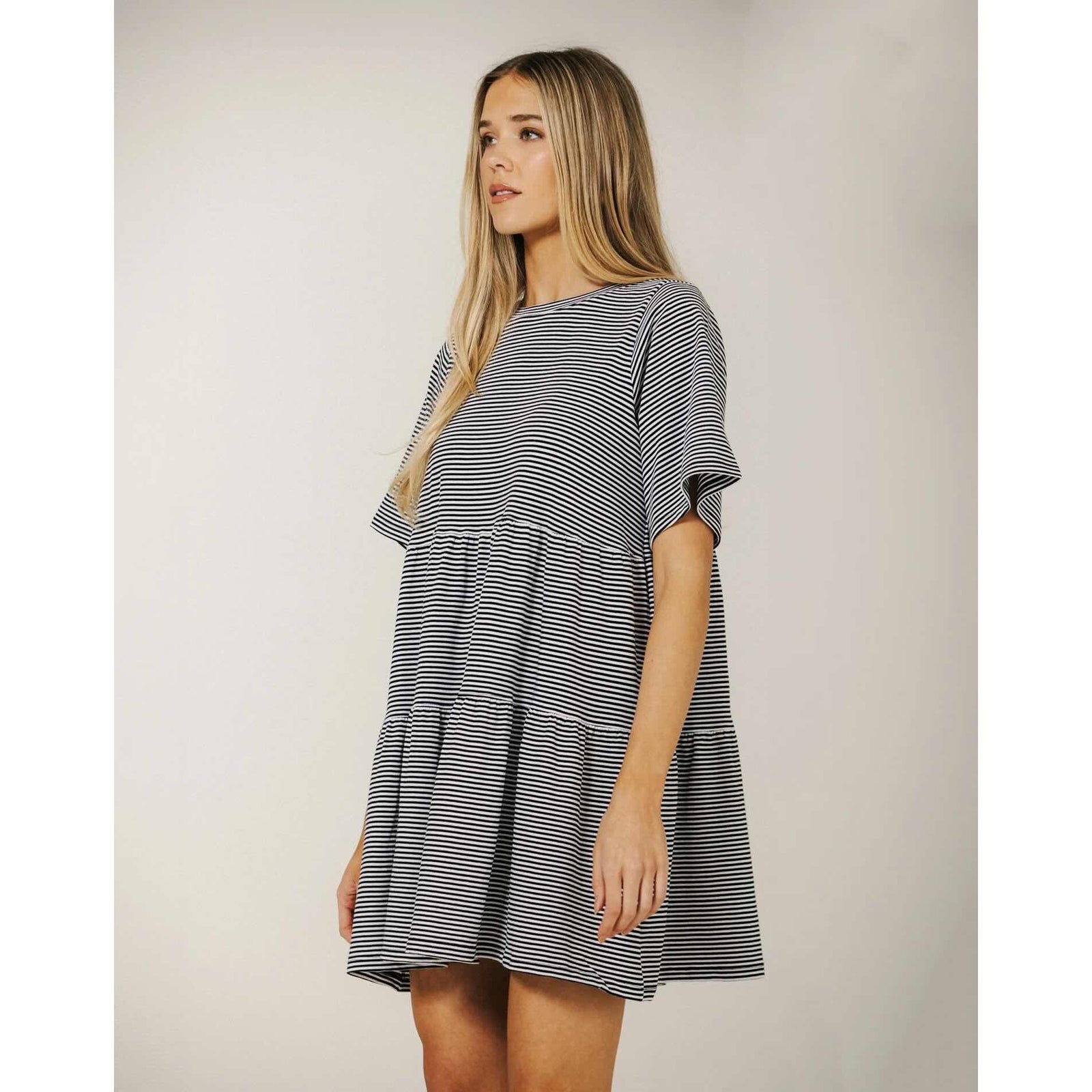 Brunette The Label Tiered Dress on model, navy and white stripes, oversized relaxed fit, tiered skirt.