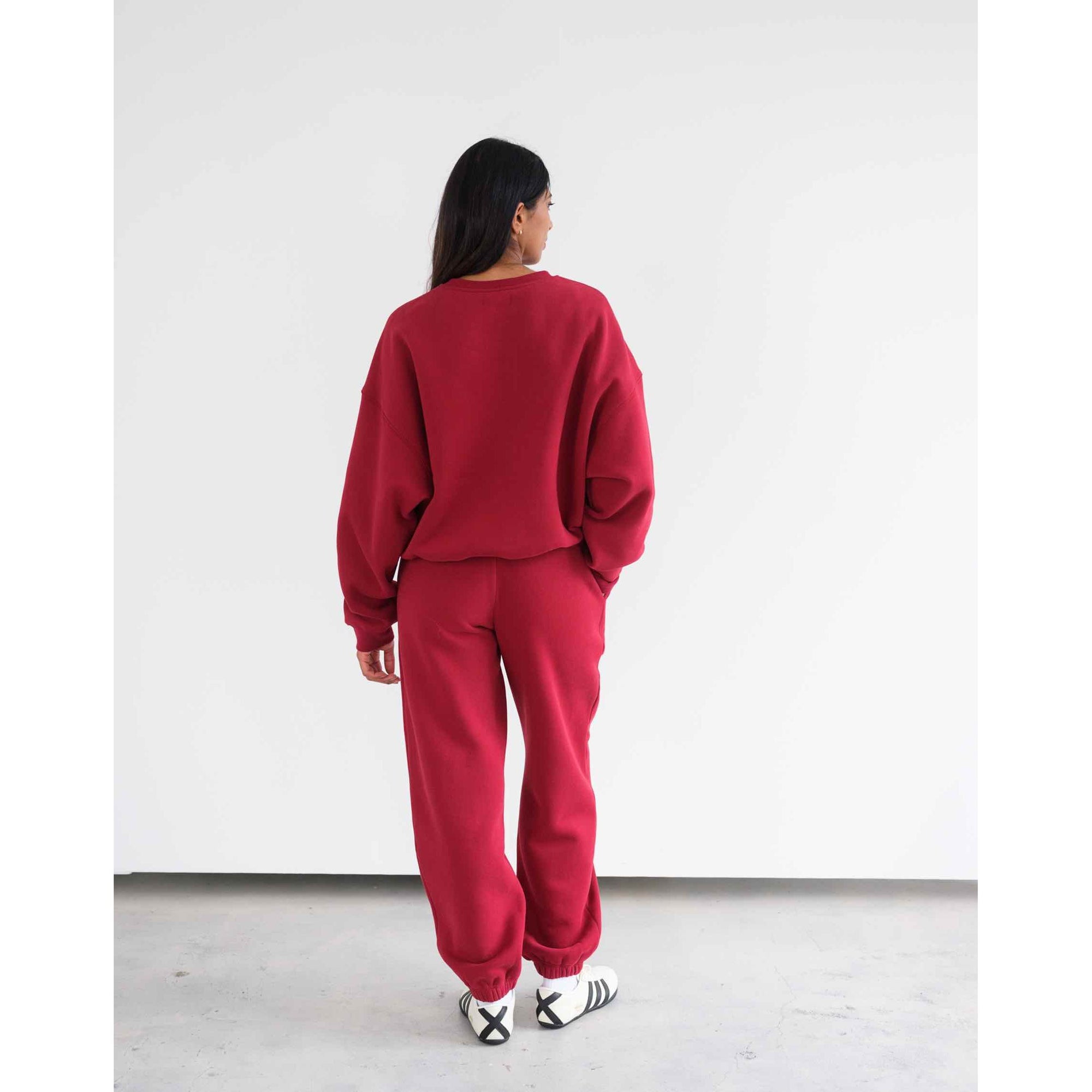 Back view of burgundy Brunette the Label Uplift Oversized Jogger set with high-rise waist and pockets.