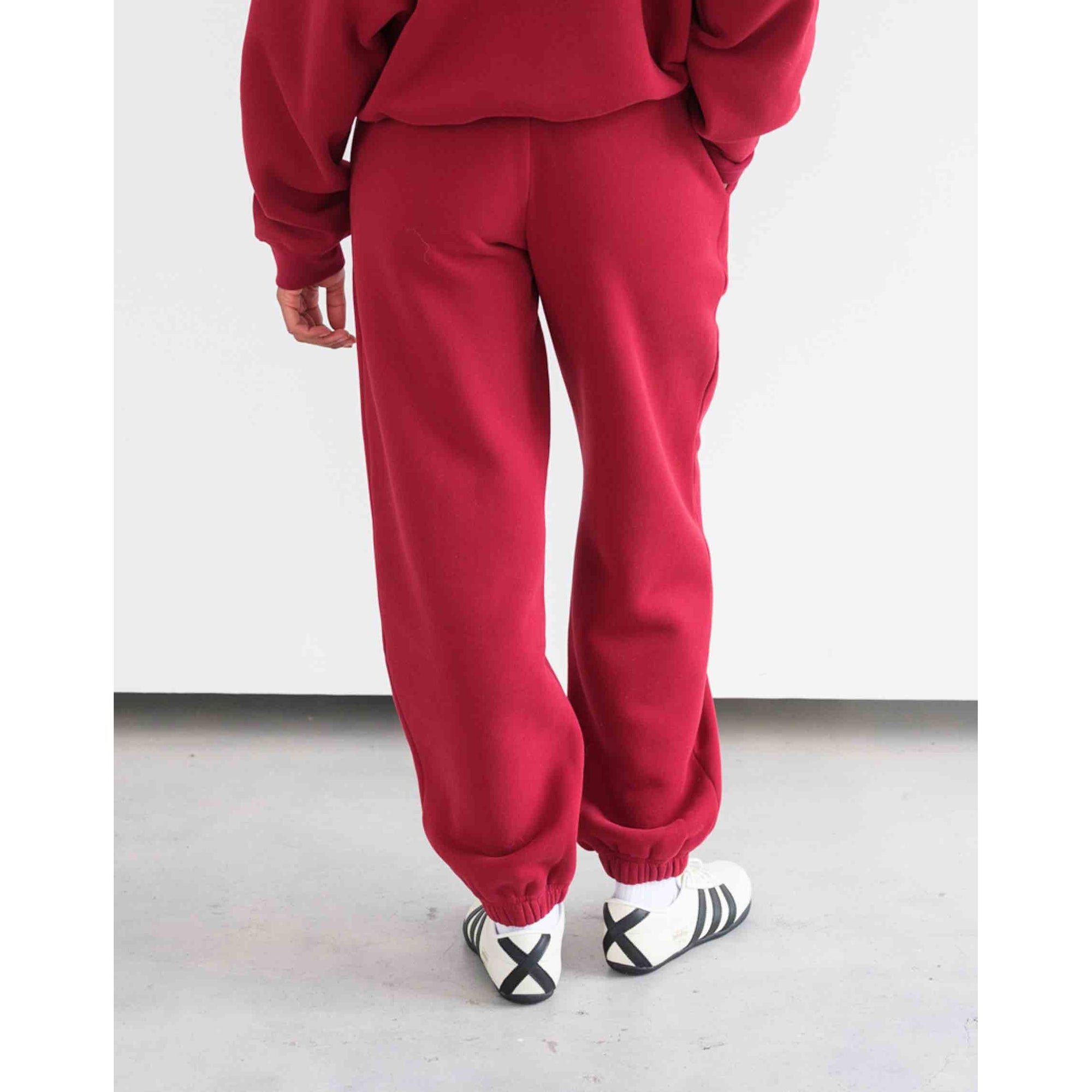 Brunette the Label Uplift Oversized Jogger in red, high-rise drawstring waist, wide leg, two side pockets, cuffed hems.