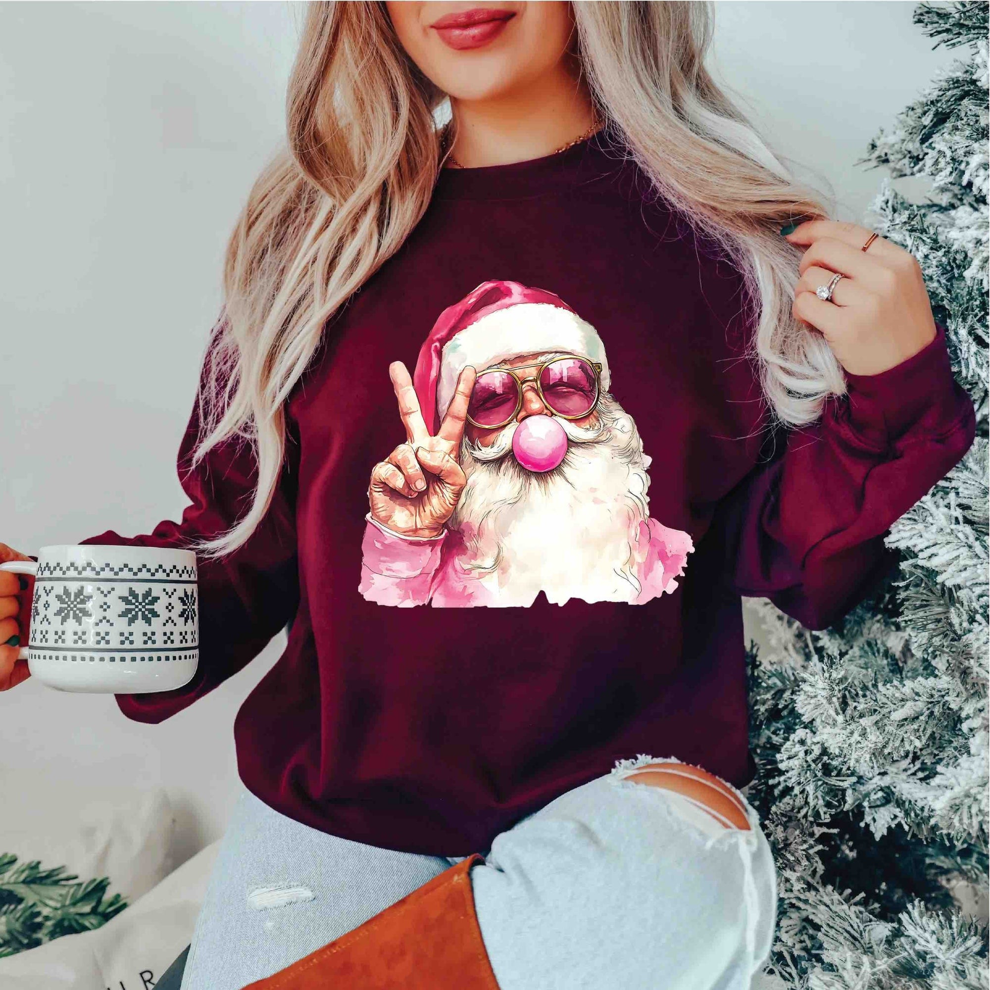 Bubble Gum Santa Crew: Santa with bubble gum nose flashing a peace sign on a burgundy sweatshirt.