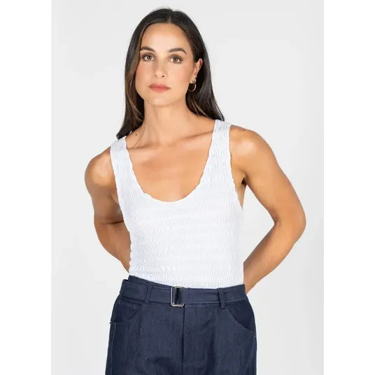 White textured smocked V-neck tank top with a contoured silhouette, made from soft rayon from bamboo fabric blend.