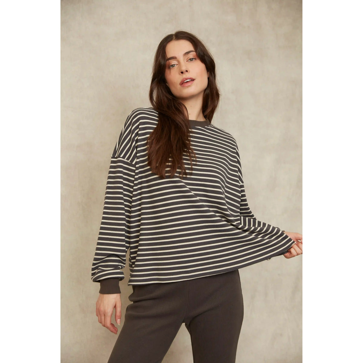 Model wearing a relaxed-fit Colbert Striped Waffle Top with horizontal stripes and long sleeves.
