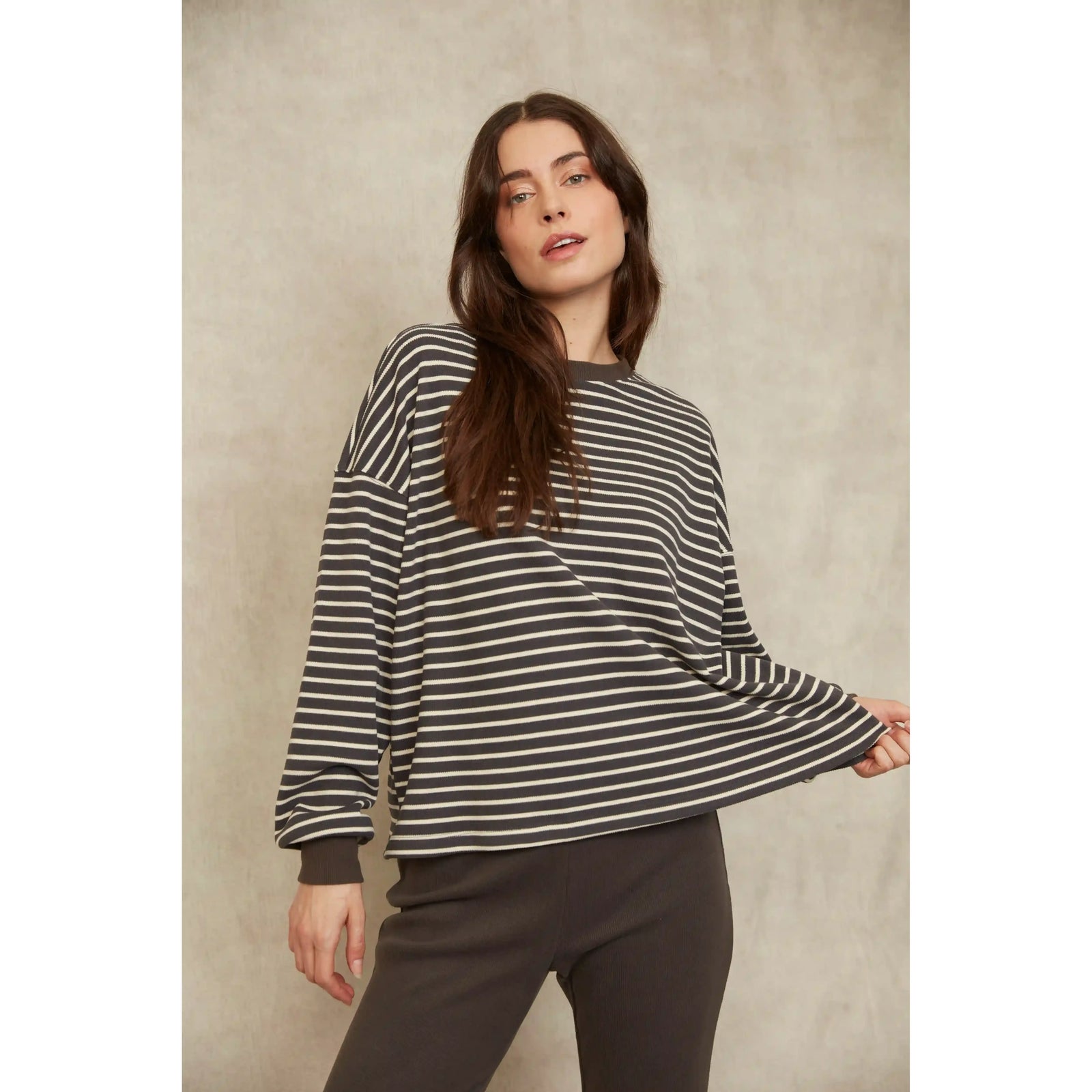 Model wearing a relaxed-fit Colbert Striped Waffle Top with horizontal stripes and long sleeves.