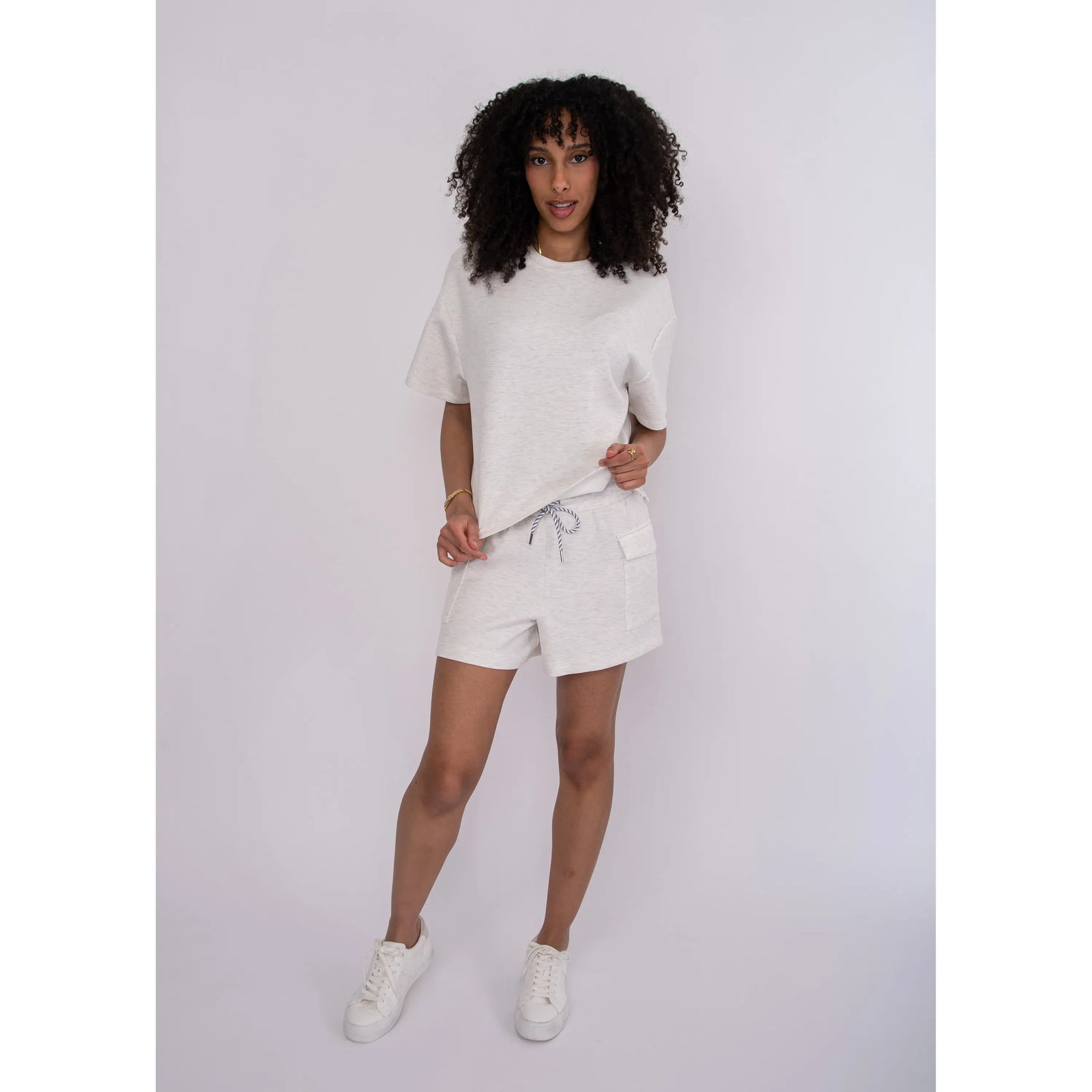 Darcia Soft Knit Drawstring Shorts in black with front pockets and a white drawstring.