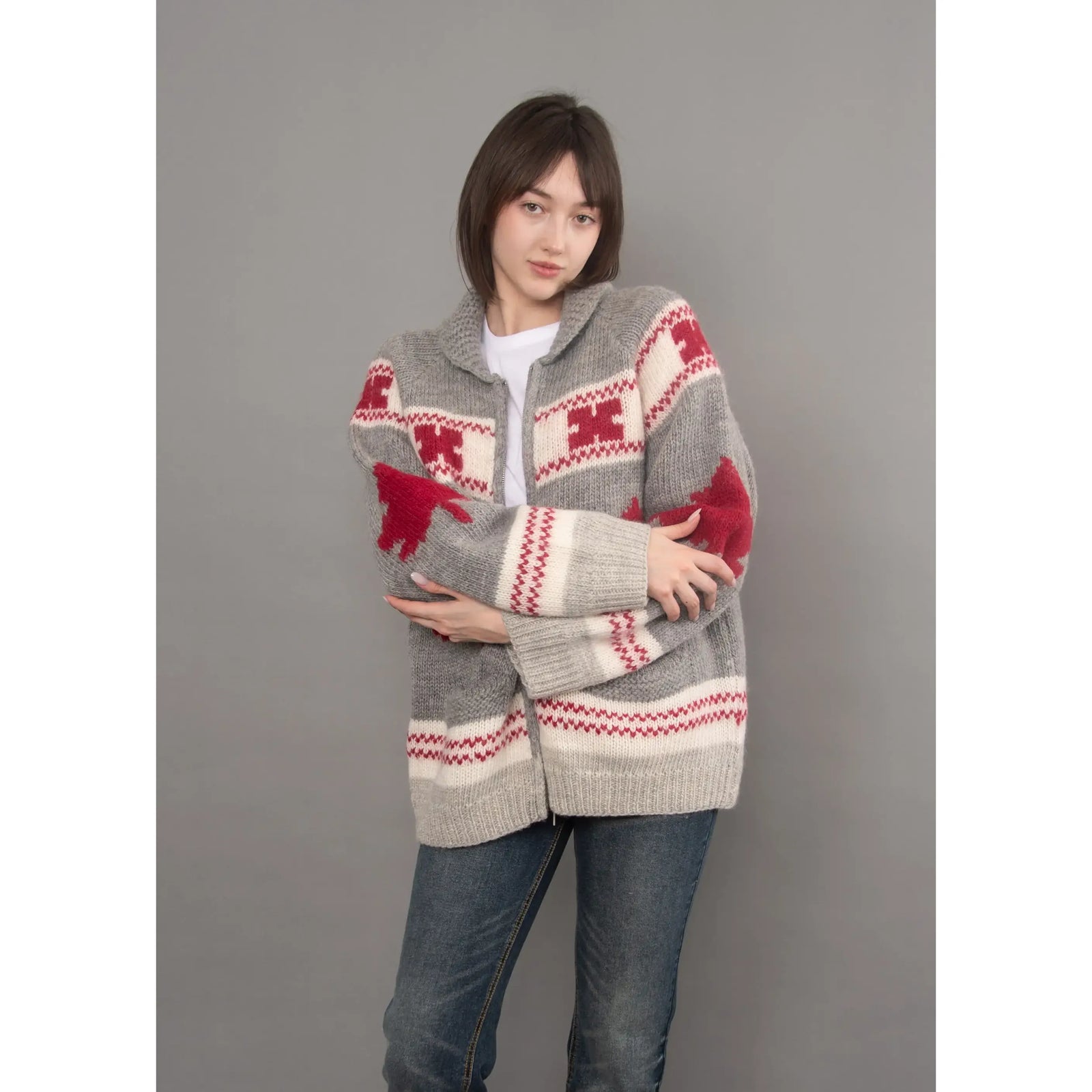 Daria Raglan Shawl Collar Sweater in grey knit with red geometric patterns, featuring cozy shawl neckline and sporty raglan sleeves for sophisticated comfort.