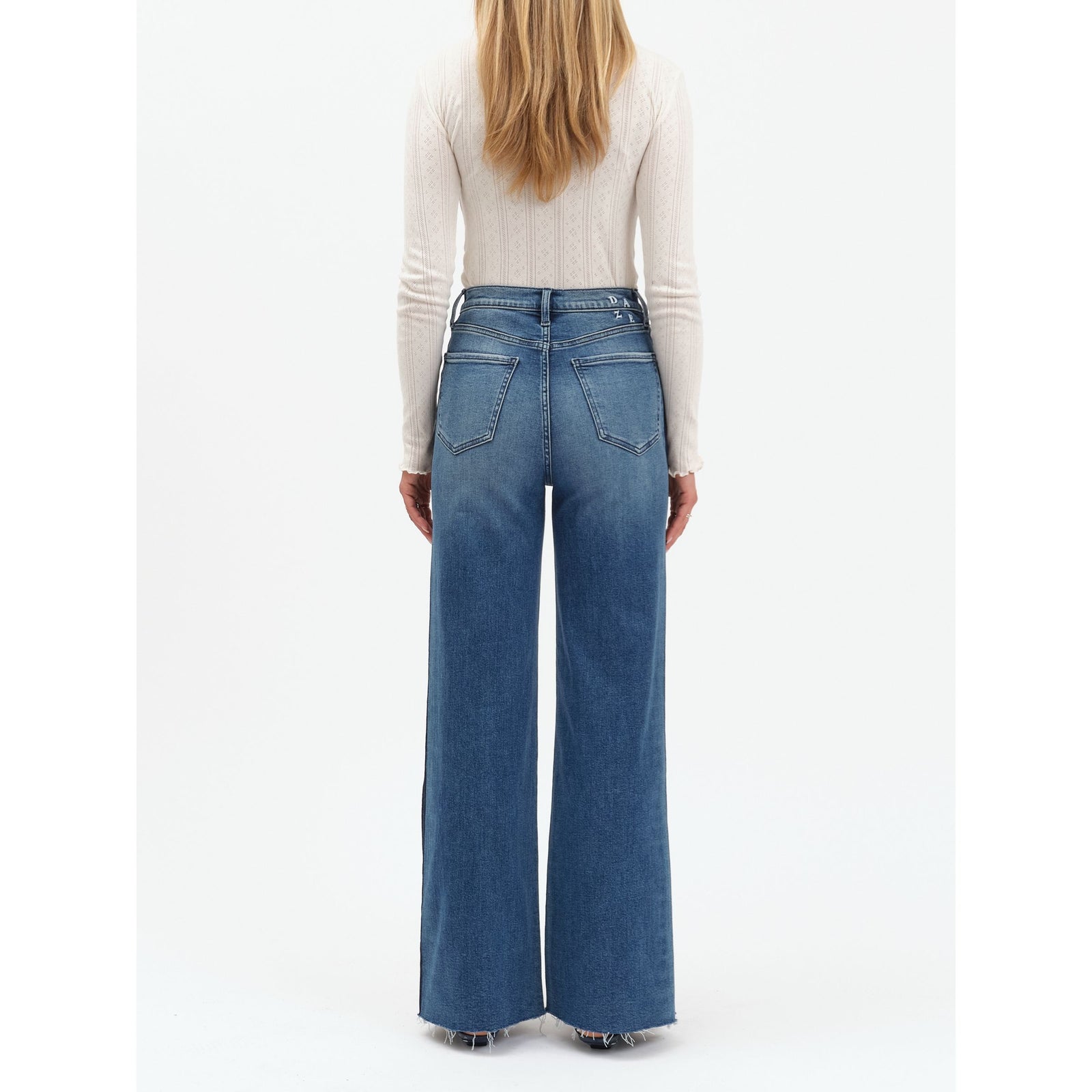 Daze Far Out High Rise Wide Leg in Tuxedo jeans, back view of a model in blue denim with a high waist and wide legs.
