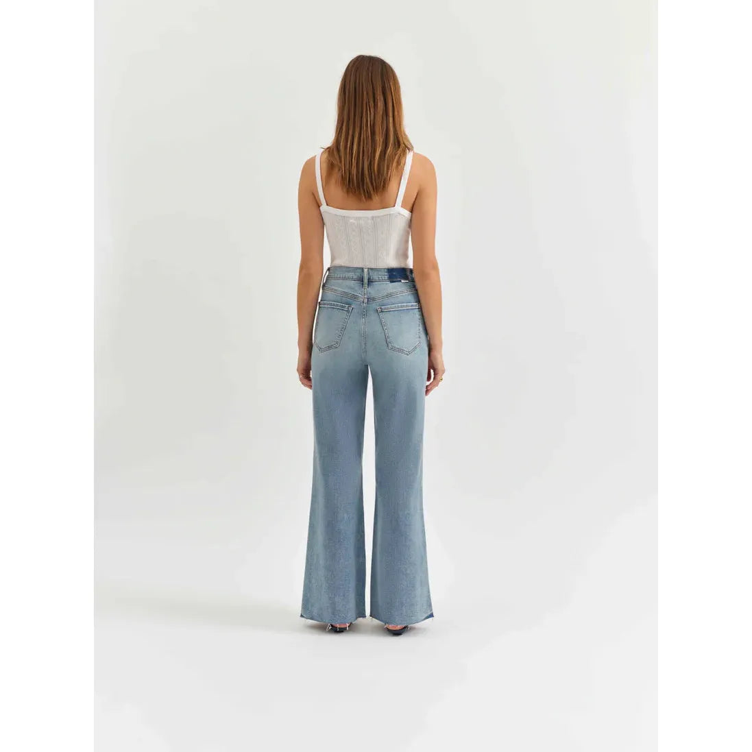 Daze Far Out High Rise Wide Leg in Fools Gold showcases a stylish back view with scissor-cut hems and vintage vibes.