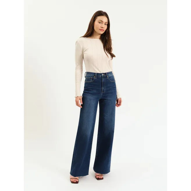 Daze Far Out High Rise Wide Leg Waterfall jeans on model in white knit top, dark wash