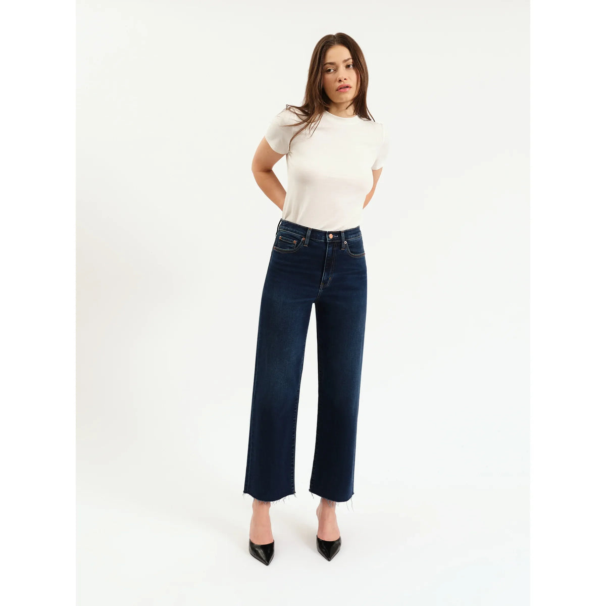 Daze Pleaser High Rise Wide Leg Ankle in Magic Hour jeans, deep indigo on model with raw hems.