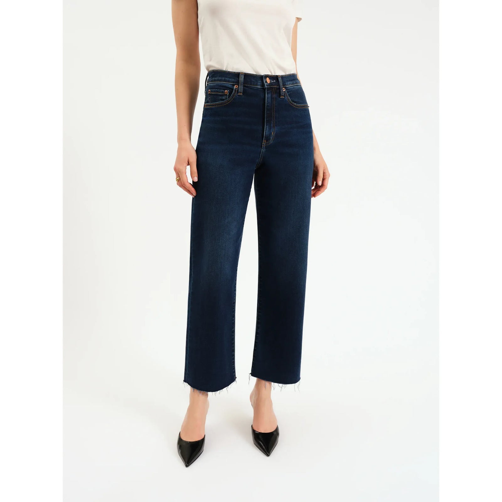 Daze Pleaser High Rise Wide Leg Ankle in Magic Hour jeans, deep indigo on model with raw hems.