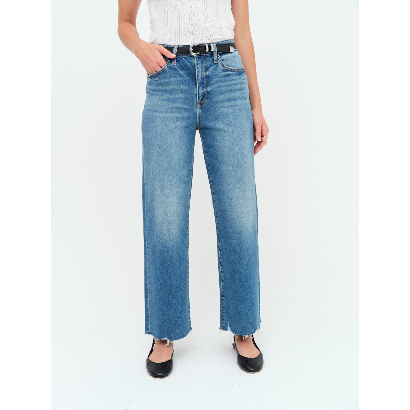 Daze Pleaser high-rise wide-leg ankle jeans in Vibe Check, Hug denim, frayed hem, model in white top.