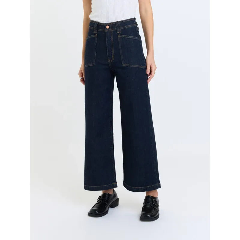 High-rise wide leg ankle jeans in deep indigo rinse featuring vintage-inspired front patch pockets and comfort stretch denim.