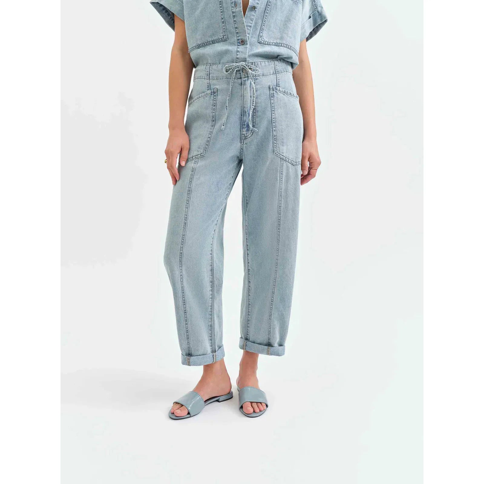 Daze Villa Drawstring Jumpsuit in Wildcard showcases a stylish, airy denim design with a customizable fit.