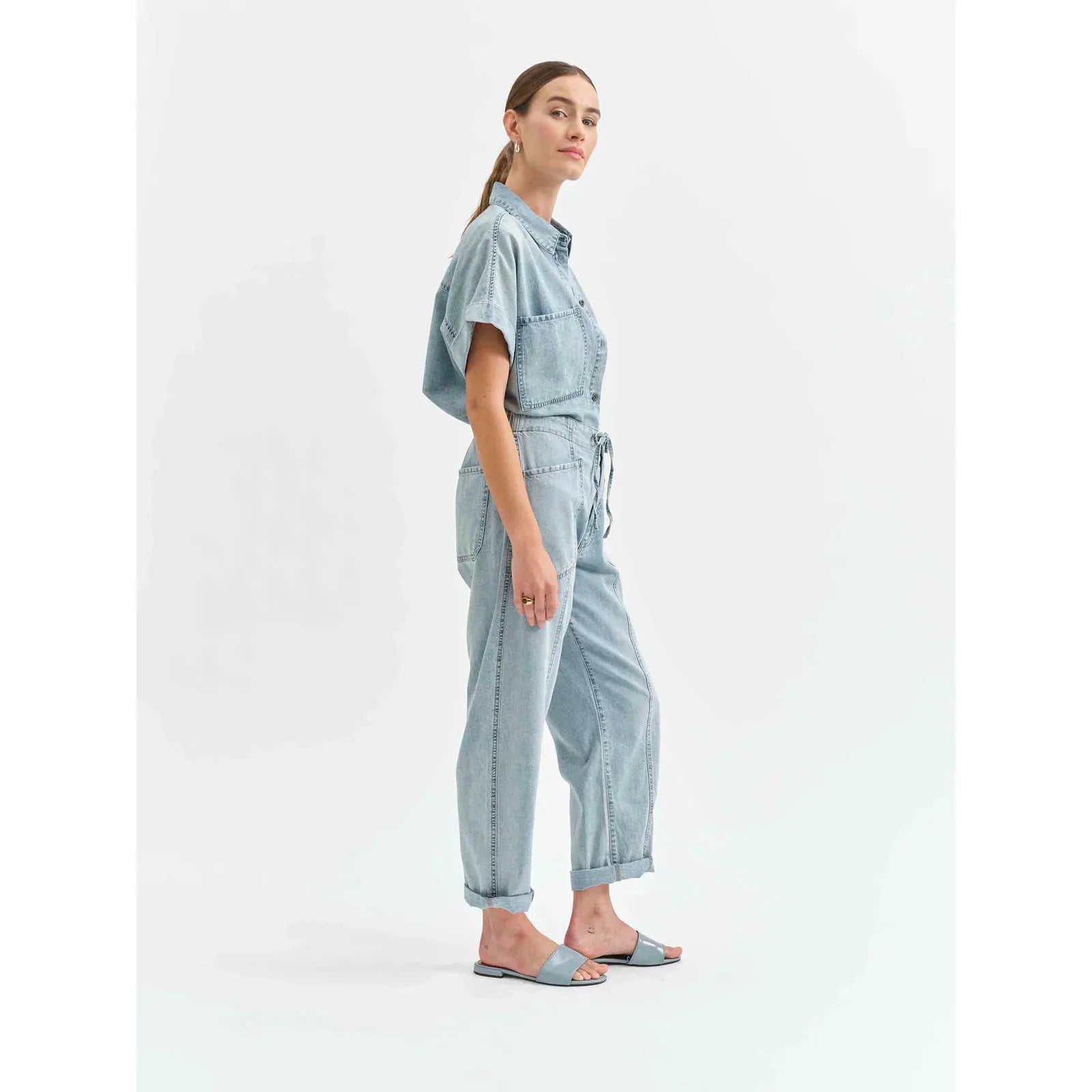Stylish model showcasing the Daze Villa Drawstring Jumpsuit in Wildcard, perfect for effortless summer chic.