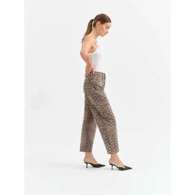 Model wearing Daze Westward Barrel Leg in Cool Cat pants; tan and black cheetah print, high-rise with cinched waist.