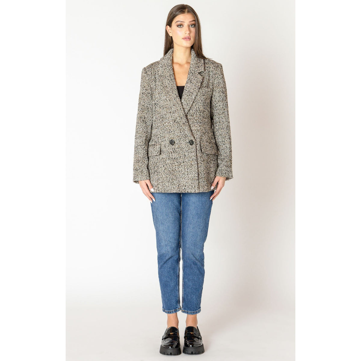 Stylish model showcasing the Dex Black Tape Textured Longline Blazer in cozy tweed for fall layering.