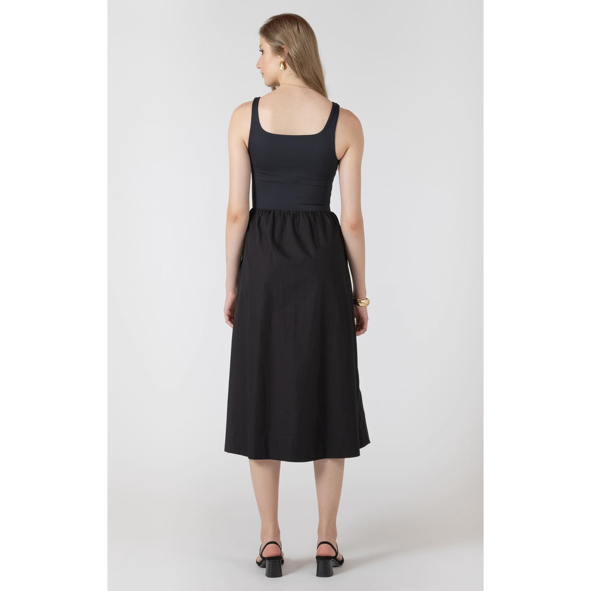 Back view of a Dex Black Tape Mixed Fabric Midi Dress with wide straps and a gathered midi skirt.