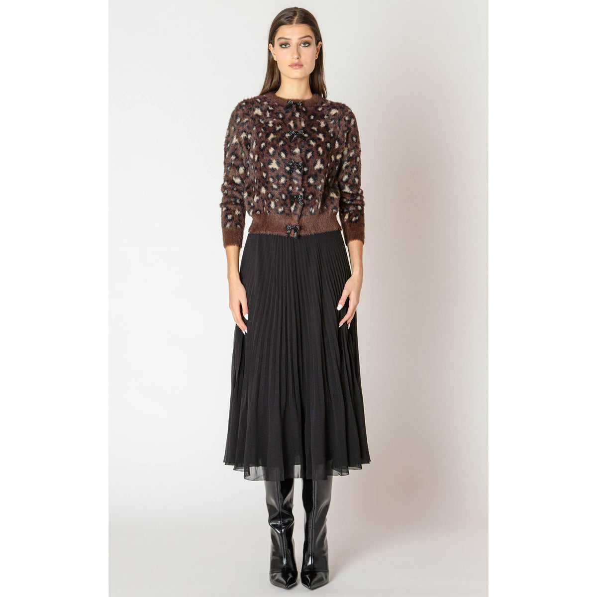 Dex Black Tape Soft Touch Patterned Cardigan with leopard print, styled with black pleated midi skirt and boots.