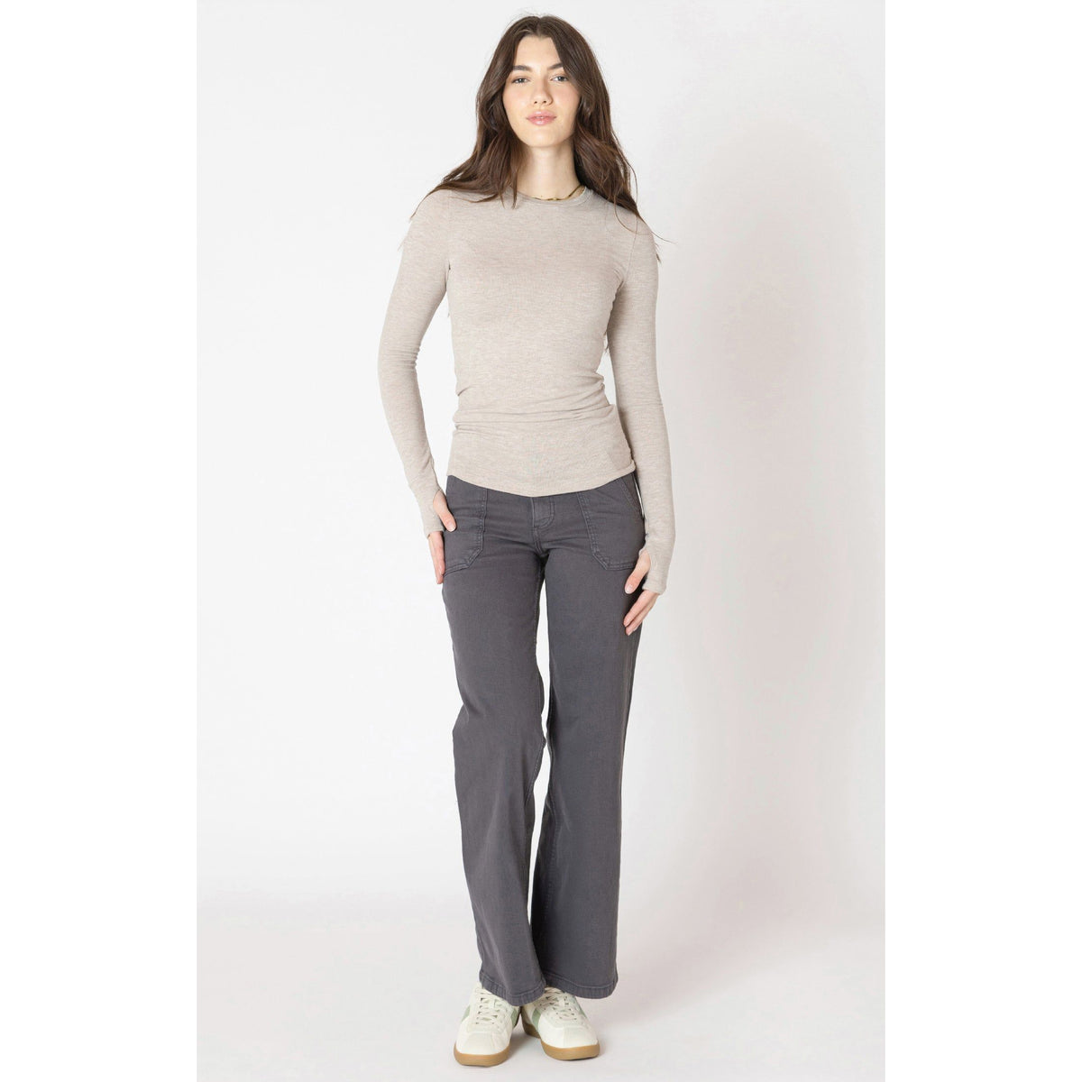 Stylish model wearing a cozy Dex Brushed Crewneck Tee in heather taupe, perfect for fall layering.