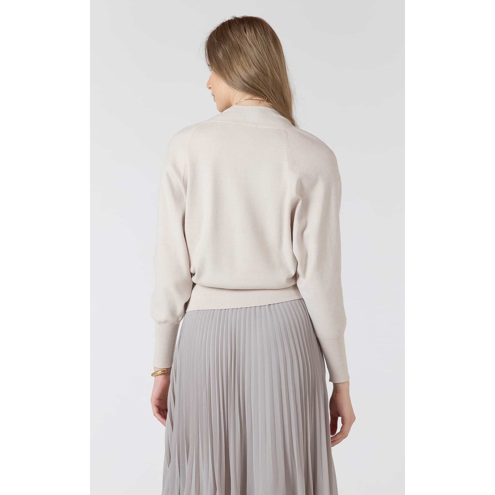 Dex Button Front Cardigan in beige on model, V-neck, button-front with ribbed hem.