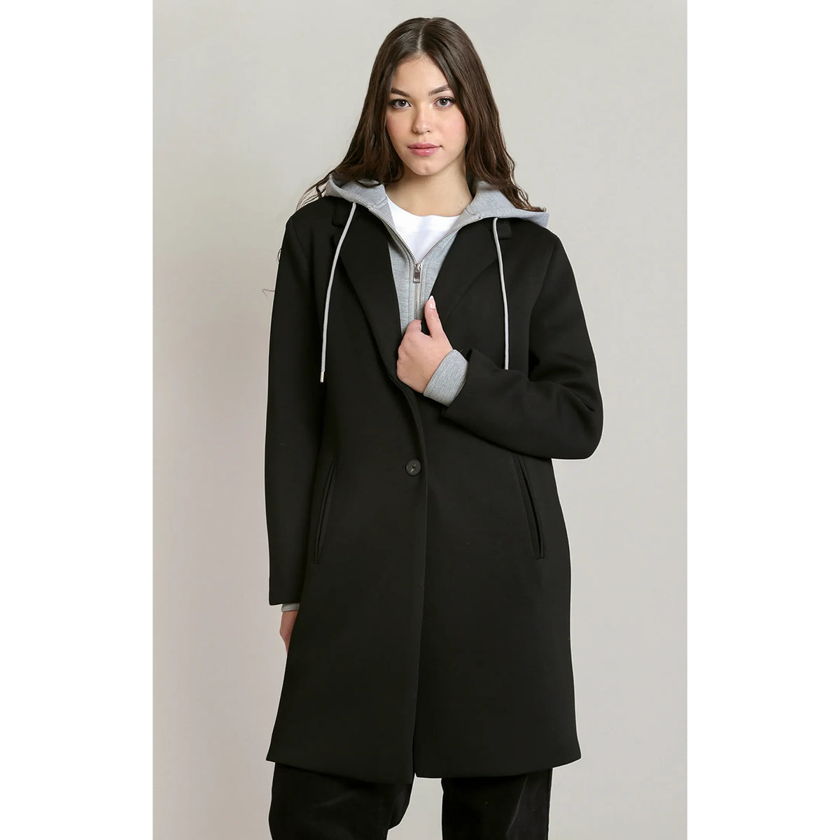 Black convertible hooded coat featuring a grey attached hoodie, button closure, and deep pockets for chic cold-weather comfort.