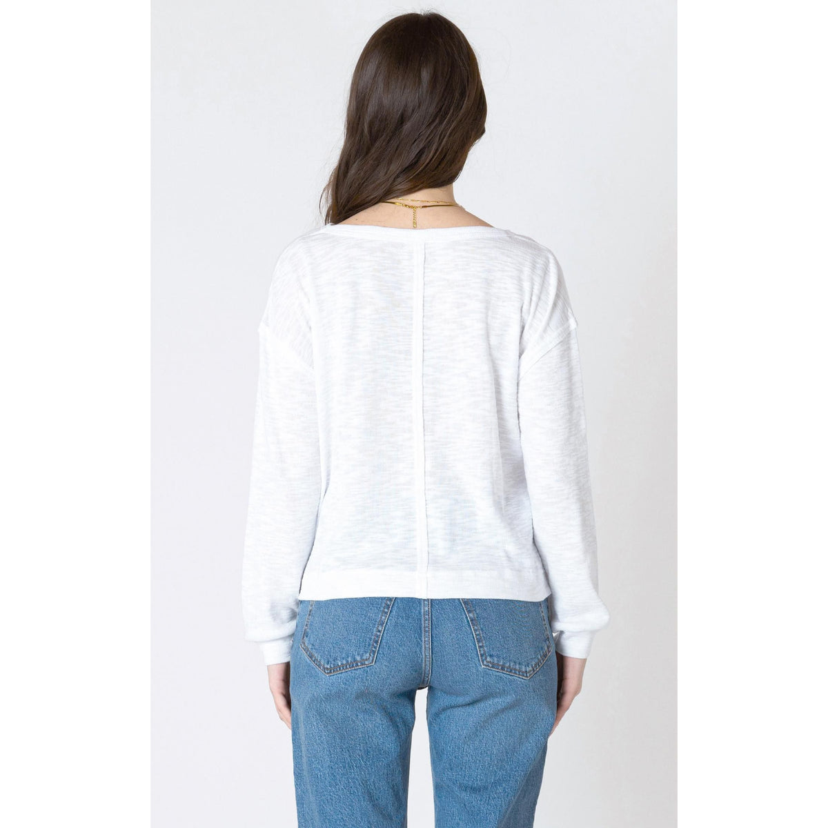 Cozy in the Dex Crew Neck Sweatshirt, featuring a ribbed neckline and chic patch pocket for a stylish look.