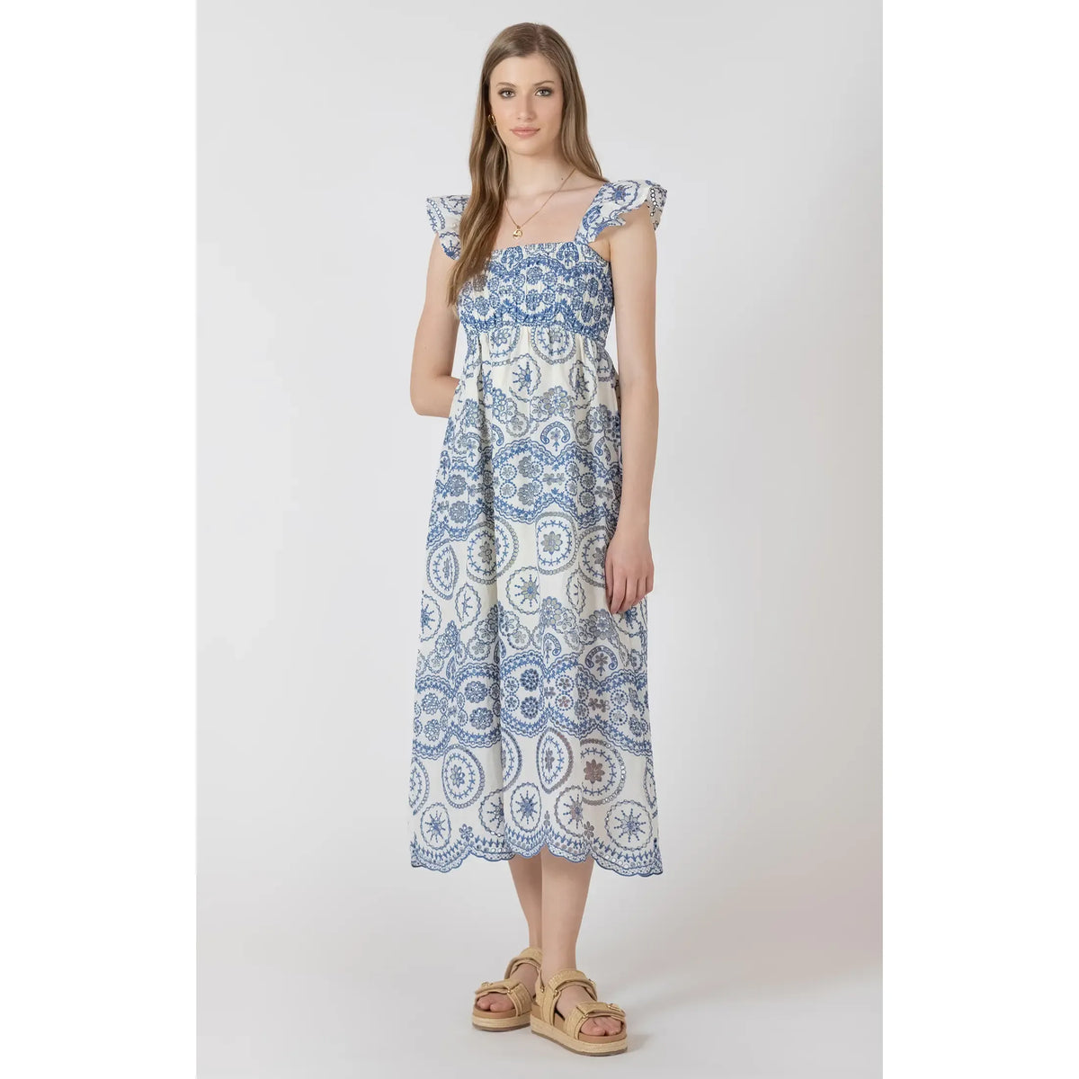 Dex V Waist Maxi Dress in blue embroidery with ruffled straps, floor-length.