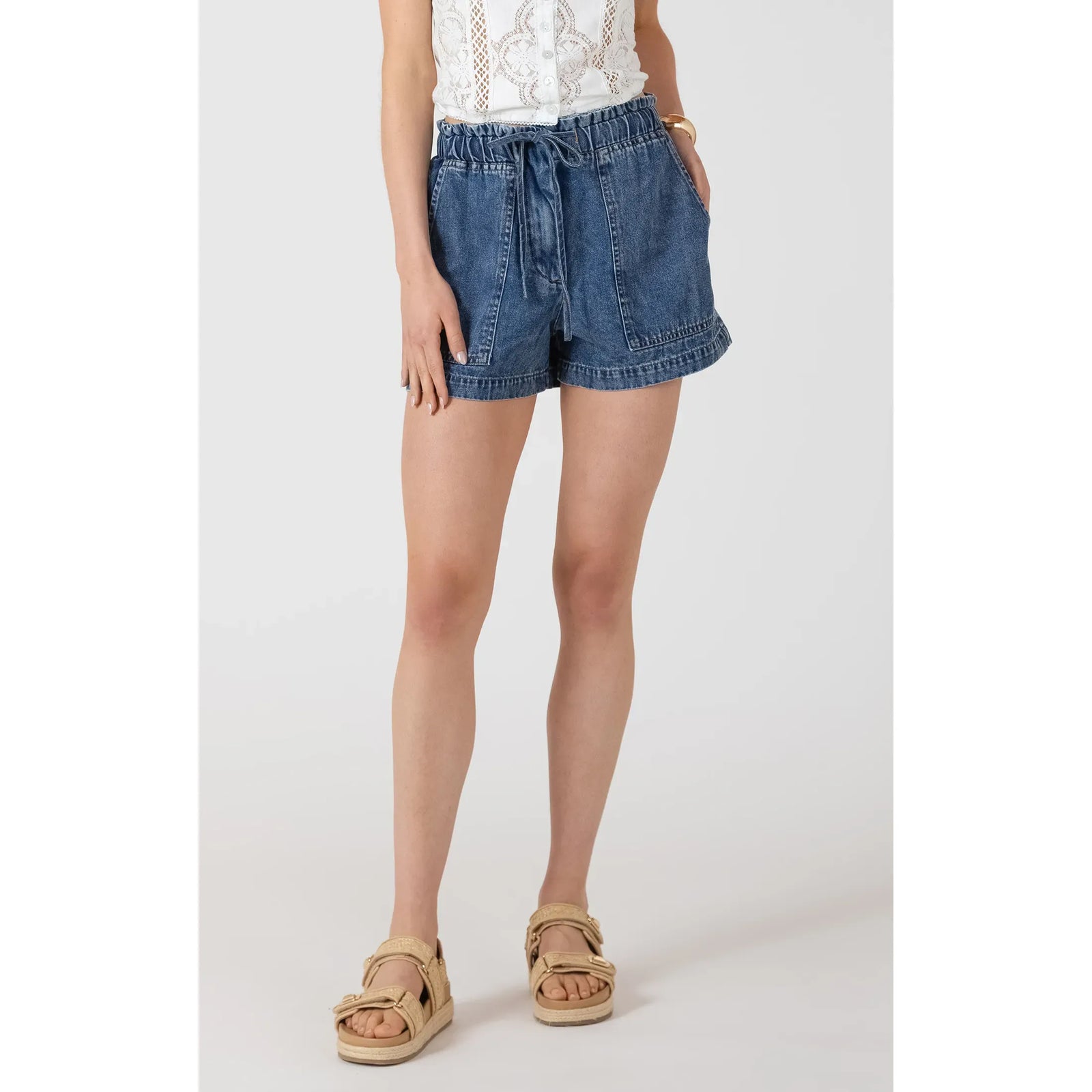Model wearing Dex Drawstring Denim Shorts in medium wash with a relaxed silhouette and adjustable drawstring waist.