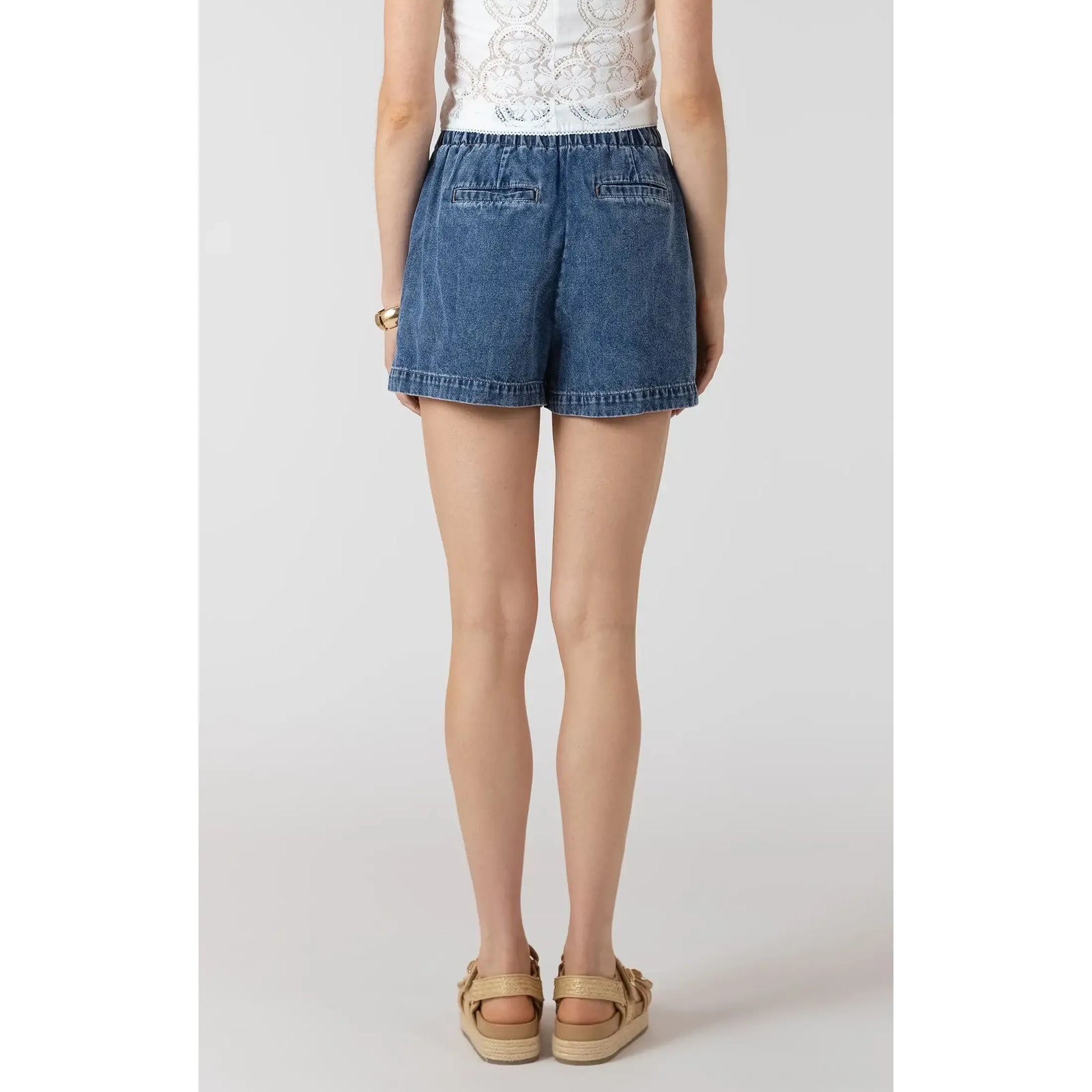 Dex Drawstring Denim Shorts in medium wash with relaxed fit, adjustable drawstring waist, back pockets.