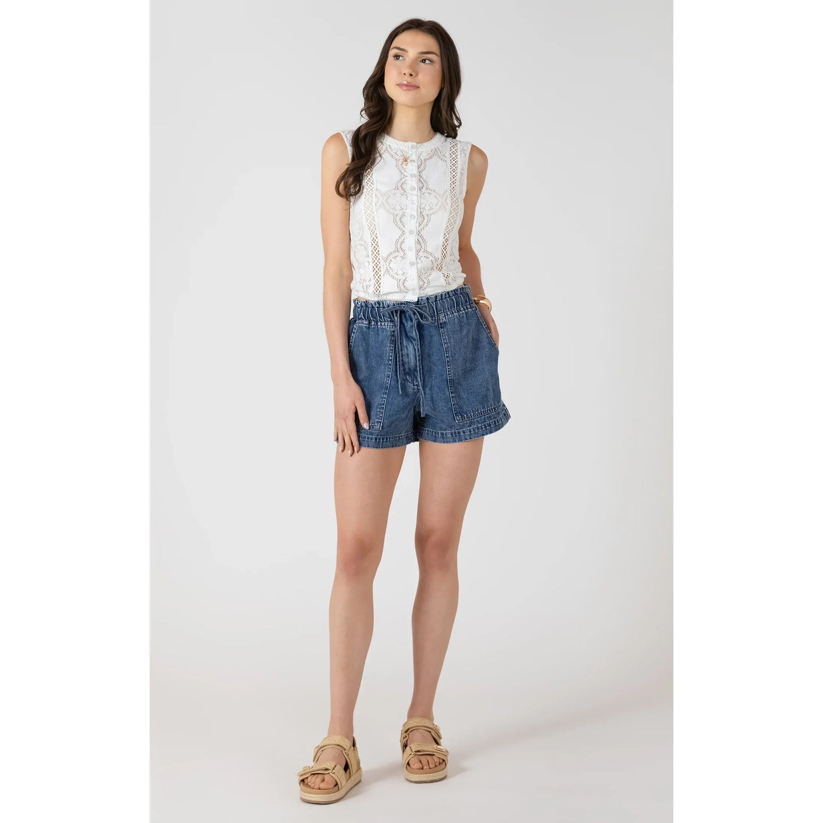 Model wearing Dex Drawstring Denim Shorts in medium wash with a relaxed silhouette and adjustable drawstring waist.