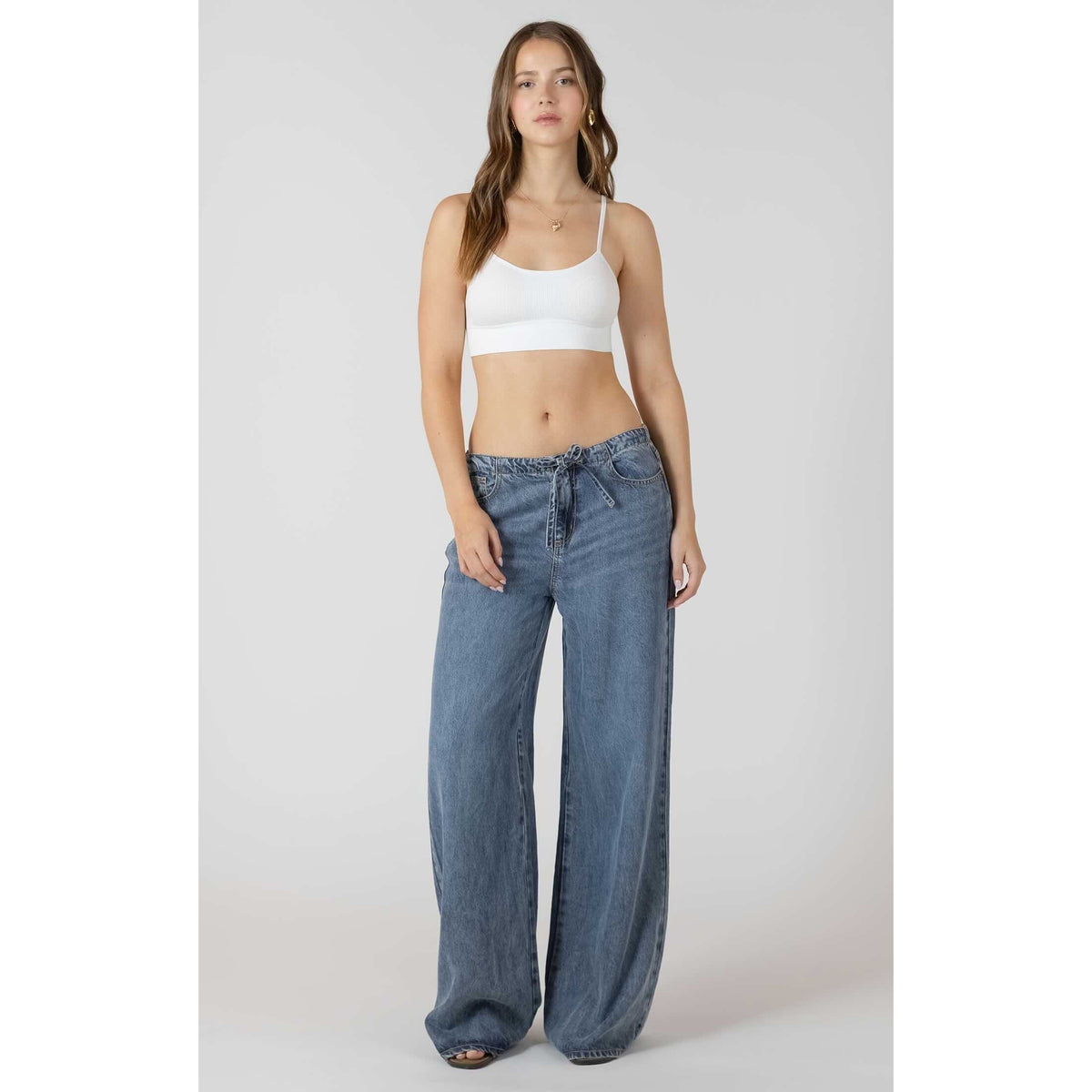 Model wears Dex Drawstring Wide Leg Denim Pant in light indigo wash with adjustable drawstring waist.