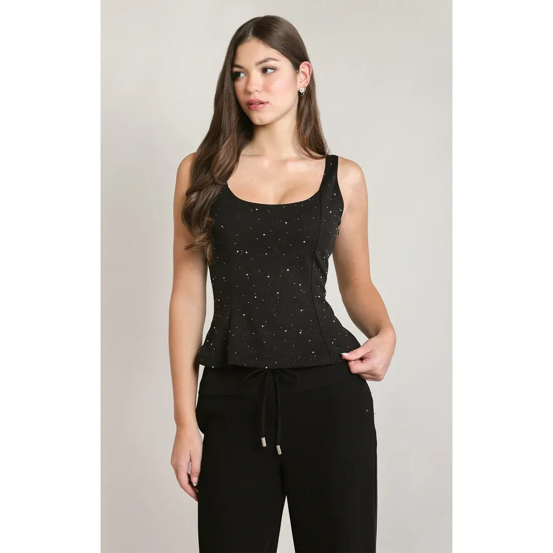 Black sleeveless peplum top with scattered rhinestone embellishments, featuring a fitted bodice and flared waist hem.