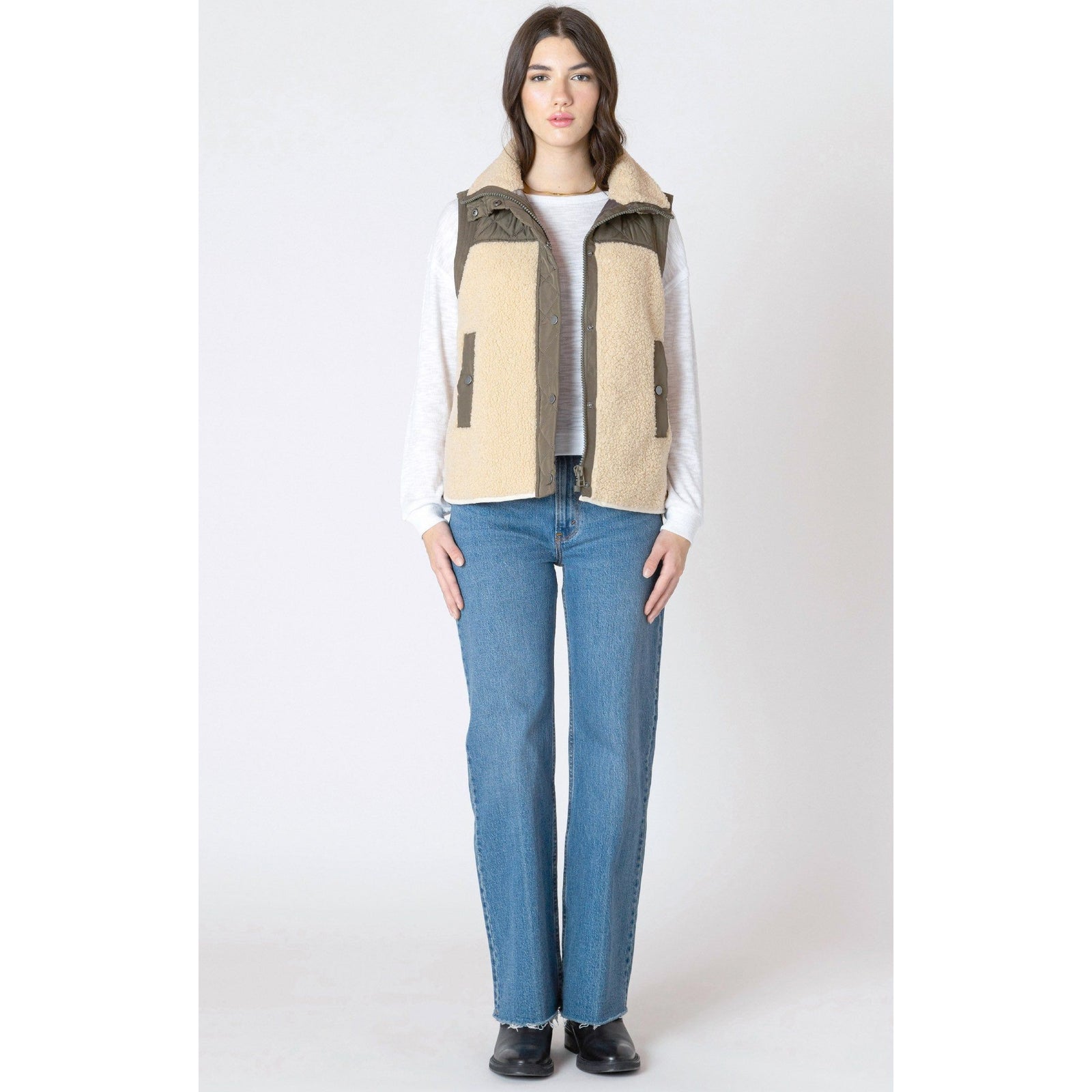 Stay cozy this season in the Dex Mixed Fabric Vest, featuring plush SHERPA trim and a stylish quilted design.